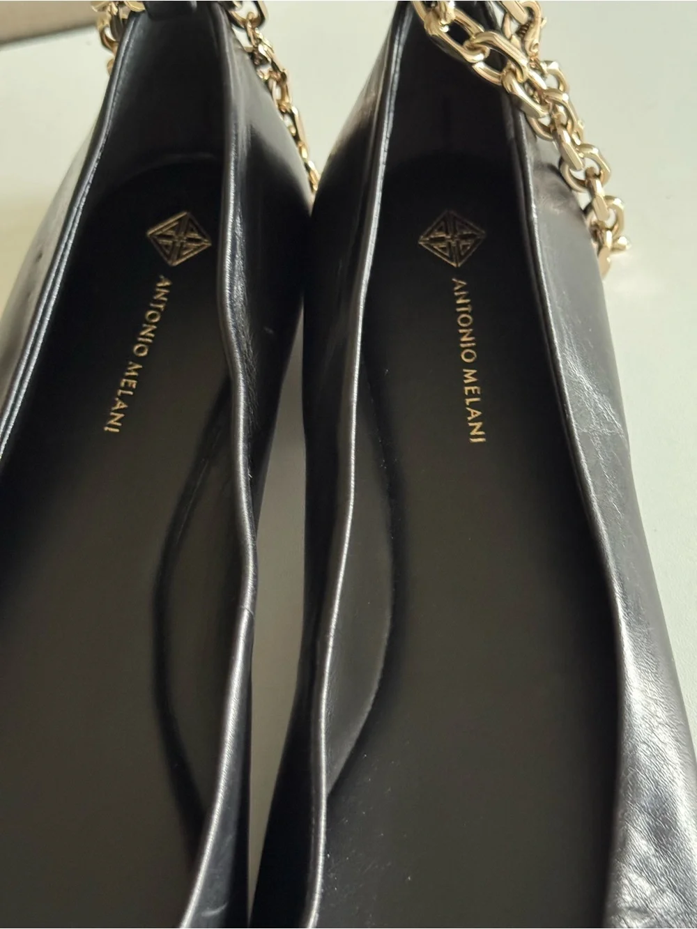 ANTONIO MELANI Black Leather Pointed-Toe Flats with Gold Chain Accent